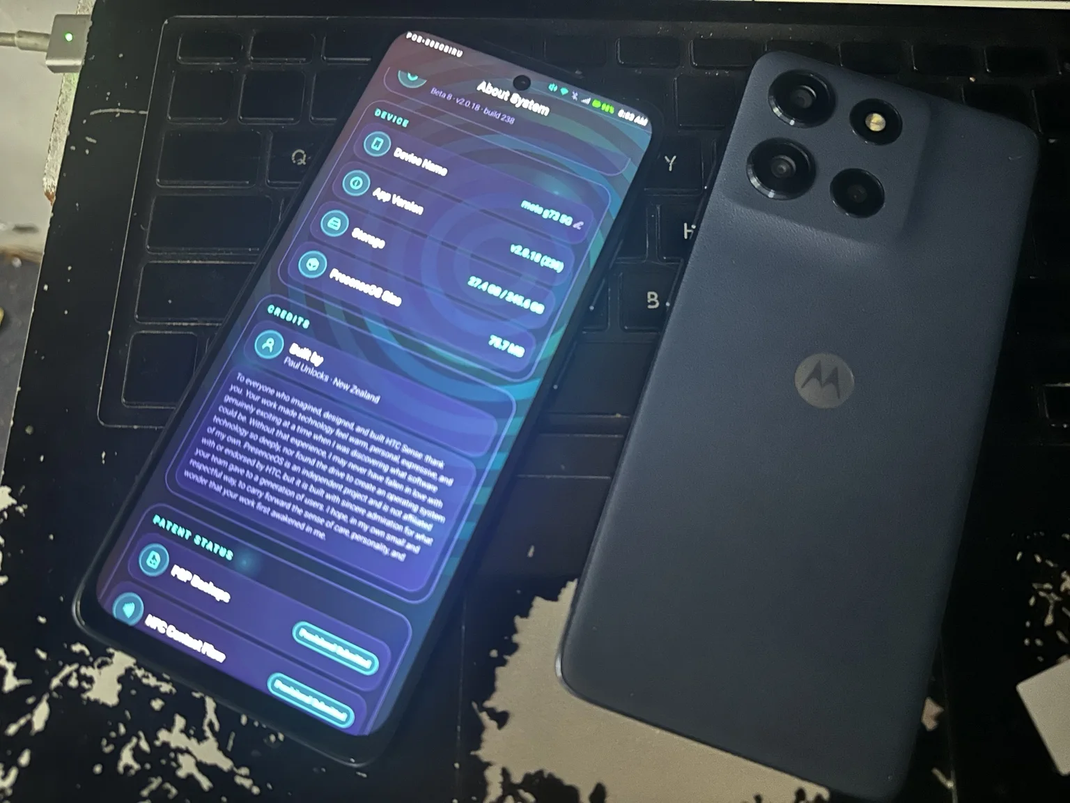 PresenceOS About System screen beside Motorola hardware